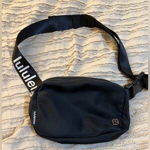 Black Lulu Lemon Everywhere belt bag  with logo on strap . Excellent condition